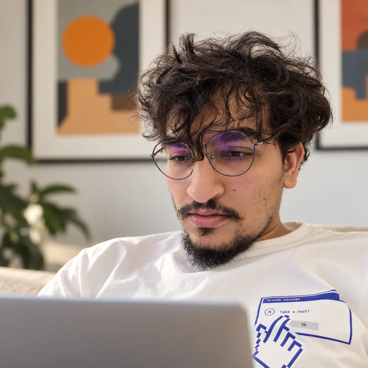 Abdelazez Hany working on his laptop