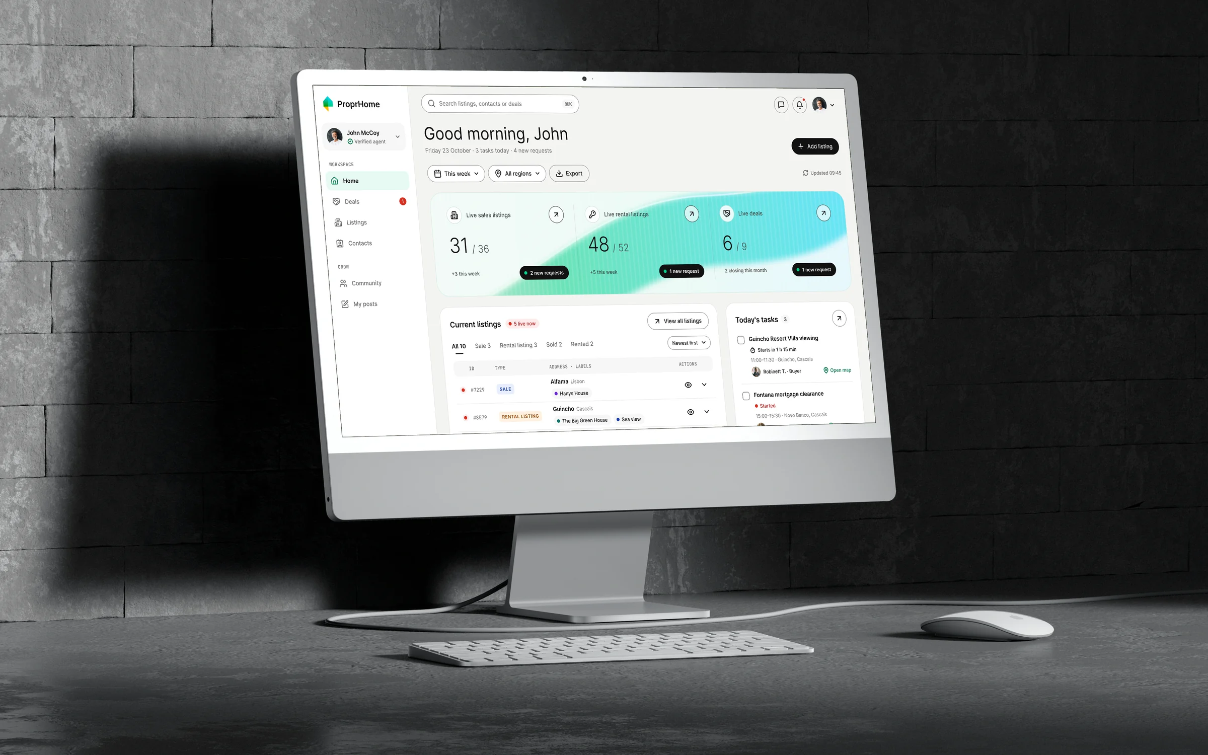 The ProprHome home screen on an angled desktop monitor: a greeting for John, a mint summary band with 31 live sales listings, 48 rentals and 6 deals, and his current listings and tasks